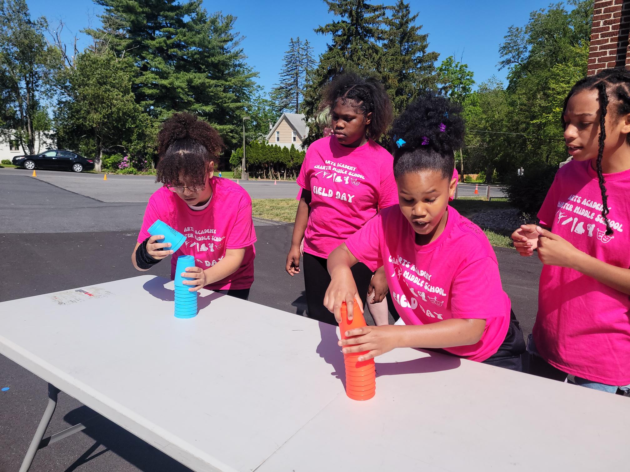 students competing in stacking cups