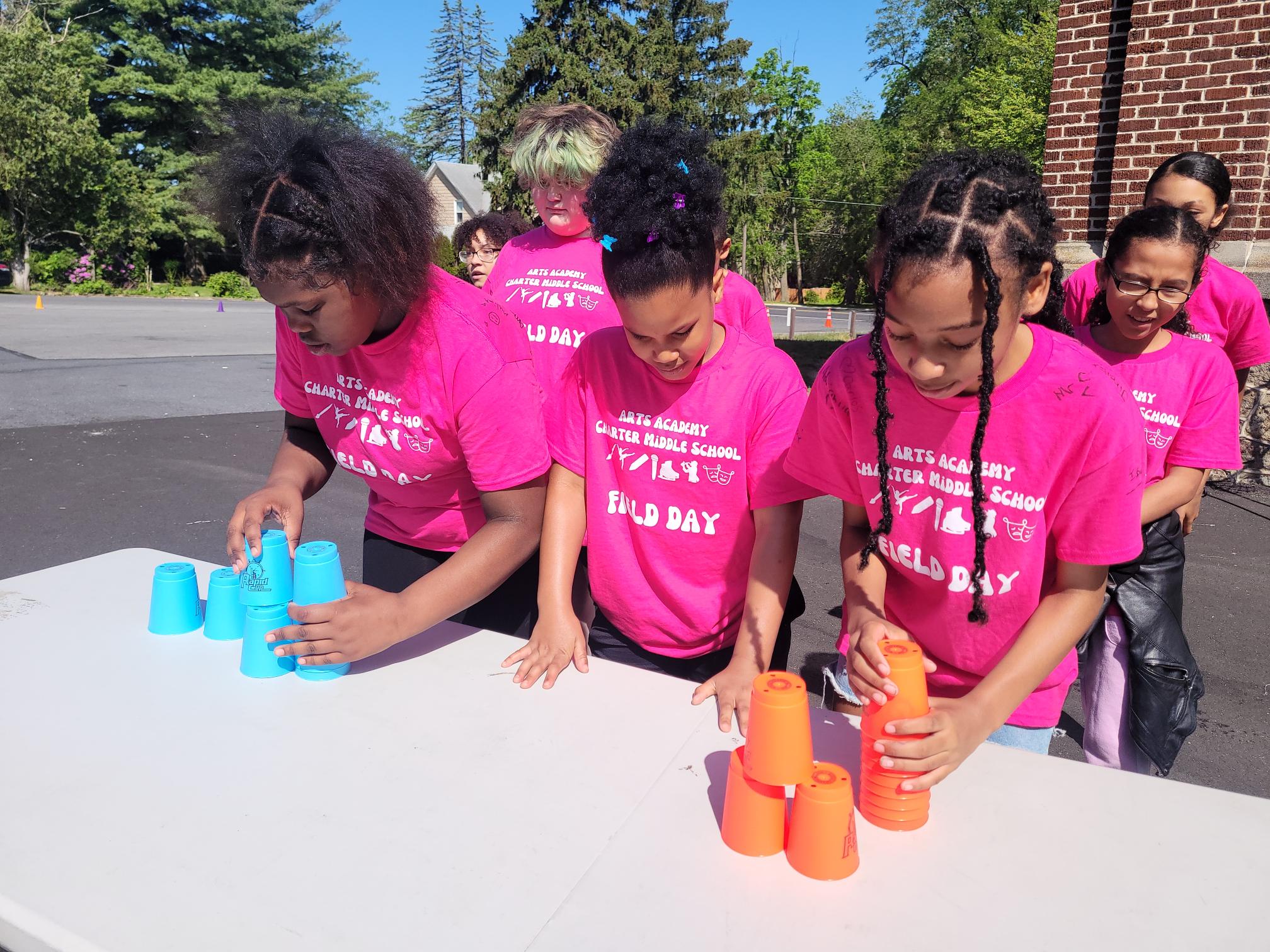 students competing in stacking cups